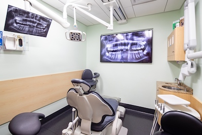 Treatment suite where patients getting dental implants can see x-rays to know exactly the procedure they are going to go through at Anchorage Midtown Dental.