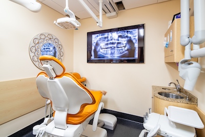 Treatment suite where patients can see images of treatment plans and why, like a root canal, at Anchorage Midtown Dental.